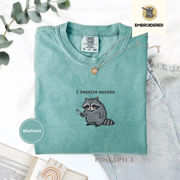 i require snacks embroidered raccoon tee